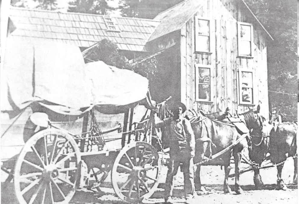 Driver Steve Burtis stood before a loaded wagon at Corral Hill Station circa 1900. collection, Friends of the Elk City Wagon Road 10 Corral Hill (17.