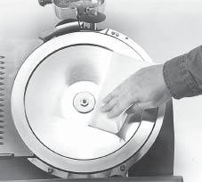 Products containing sodium hypochlorite should not be used on the slicer. NEVER try to clean, sharpen, or operate the slicer with the lift lever in the raised position (automatic slicers only).