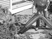 Make sure that either the collector sleeve or the optional mulch discharge hose are securely attached to the DR Lawn and Leaf Vacuum outlet chute. 1.