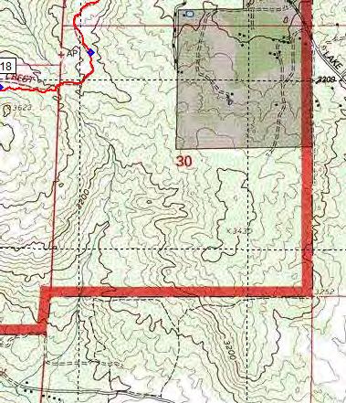 3/10 mile E of the PCT on unpaved jeep road 011 are some flat areas that could serve as campsites.