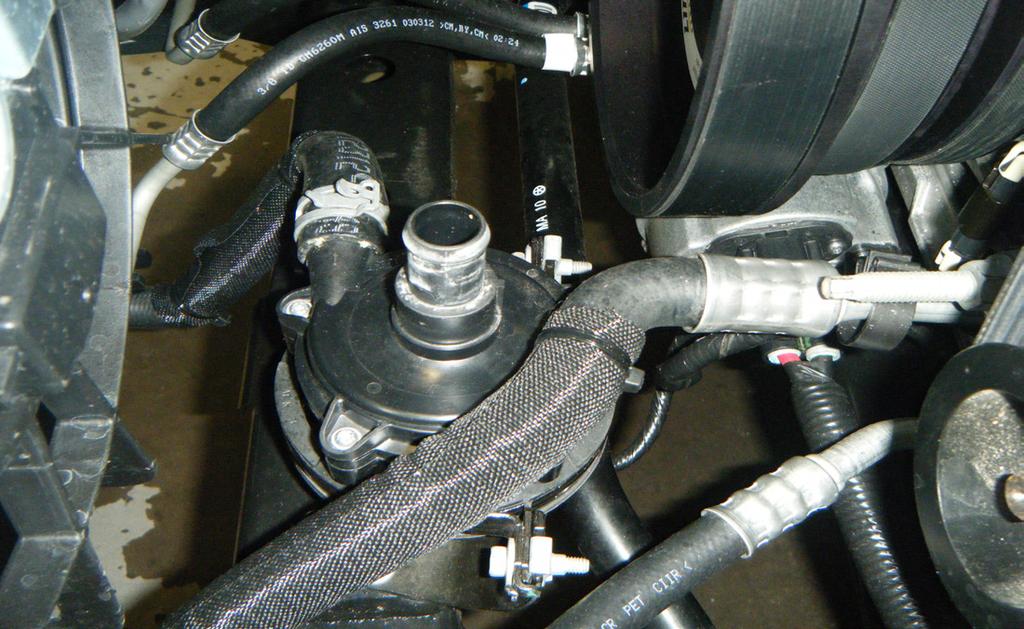 Page 3. 5. Locate the supercharger coolant pump, which can be found just below and in front of the damper.