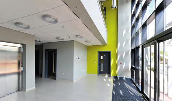 including feature lighting Hub office 1,200 sq ft 111 sq m Full height glazed entrance atria Low energy LED