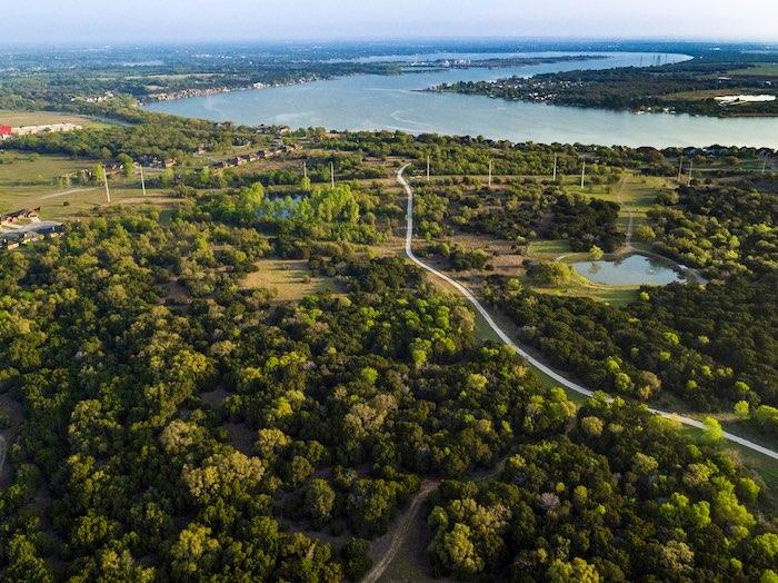 TERRAIN: Ranging in elevations from 620 +/- along the bank of the Brazos River to 775 +/- atop a plateau on the north portion of the property, Treaty Oaks provides approximately 155 of scenic rolling
