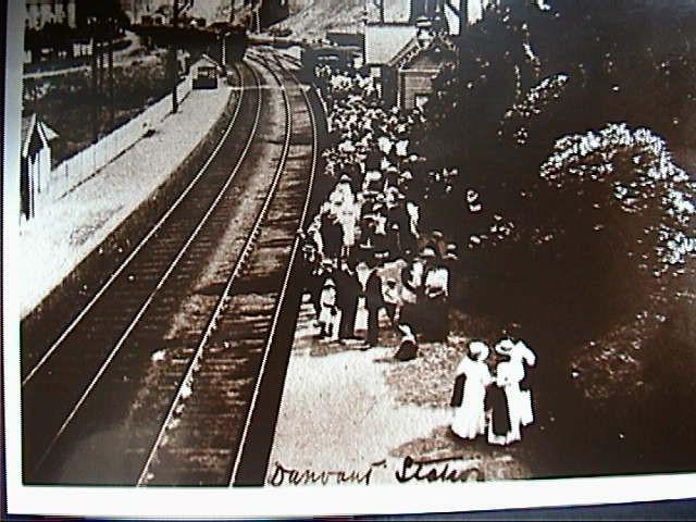The photograph is taken from the Graig overlooking the central railway line with the station on the far left.