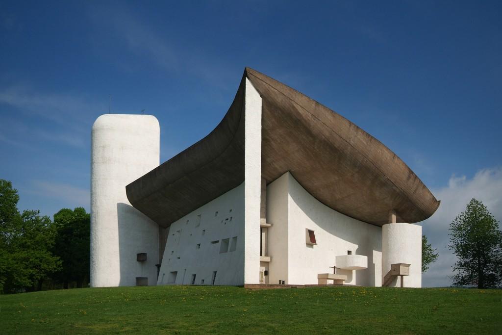 and the white-washed curved walls of rough masonry Formally and symbolically, this small building is immensely powerful and complex The heaviness of the walls and roof is misleading In Le Corbusier's