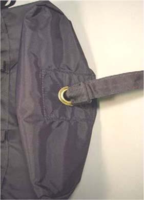 Pull the bridle through the main deployment bag grommet until the grommet is