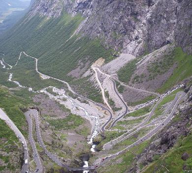 Trollstigen Mountain Road Share Tweet 0 Tucked deep into the mountains off the western coast of Norway, the Trollstigen Mountain Road is one of Norway's most dramatic and most visited attractions.