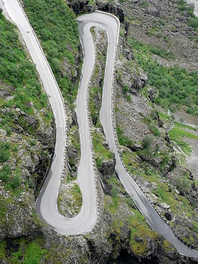 can be closed anytime when the access is not cleared of snow. Trollstigen twists and climbs through a mountainous terrain of waterfalls, fjords, tunnels and frozen lakes.