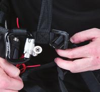 Fasten the leg/chest strap by placing the male buckles through the