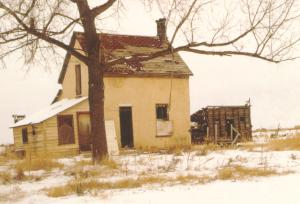 During the winter months he lived in brick house out on an isolated farm. The old house was not an easy place to locate because it was out in the middle of an cow pasture.