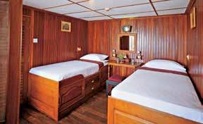 and finished with brass en suite bathroom with robe, slippers, hairdryer and fine toiletries. Several suites have and private teak. balconies.