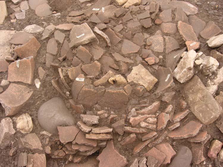 of antlers and storage vessels were dumped down the hillside (fig. 3.14). A large deposit of ash and antler lies around the north and east sides of A1. We plan to complete excavating this in 2004.