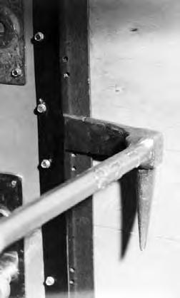 Drive adz end of the Halligan Tool under the edge and push tool toward the door.