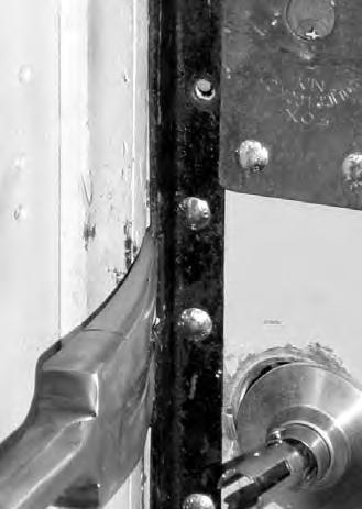 Forcible Entry Notebook The steel angle iron is bolted to the edge of an inward swinging door.