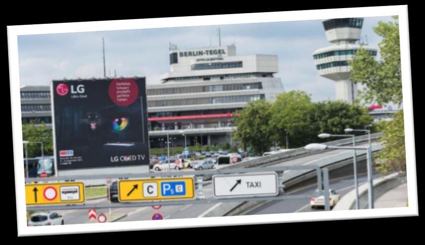 The new double-sided Giant Poster is located at a central position, at the peak of the airport s only driveway, reaching