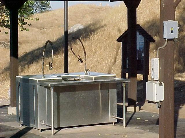 Photo L-1. Fish-cleaning station. Hensley Lake, CA.