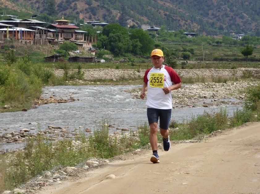 The marathon route then rises up on the road for 3km on to 2,400m, followed by a short climb on a wide track before picking up forest trails along a line of Chortens festooned with prayer flags.