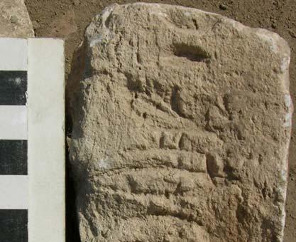 8: Talatat fragments of the sun-temple of Echnaton at Heliopolis; a) rays of the sun-disc with offering in the background; b) title and name of queen Nofretete.
