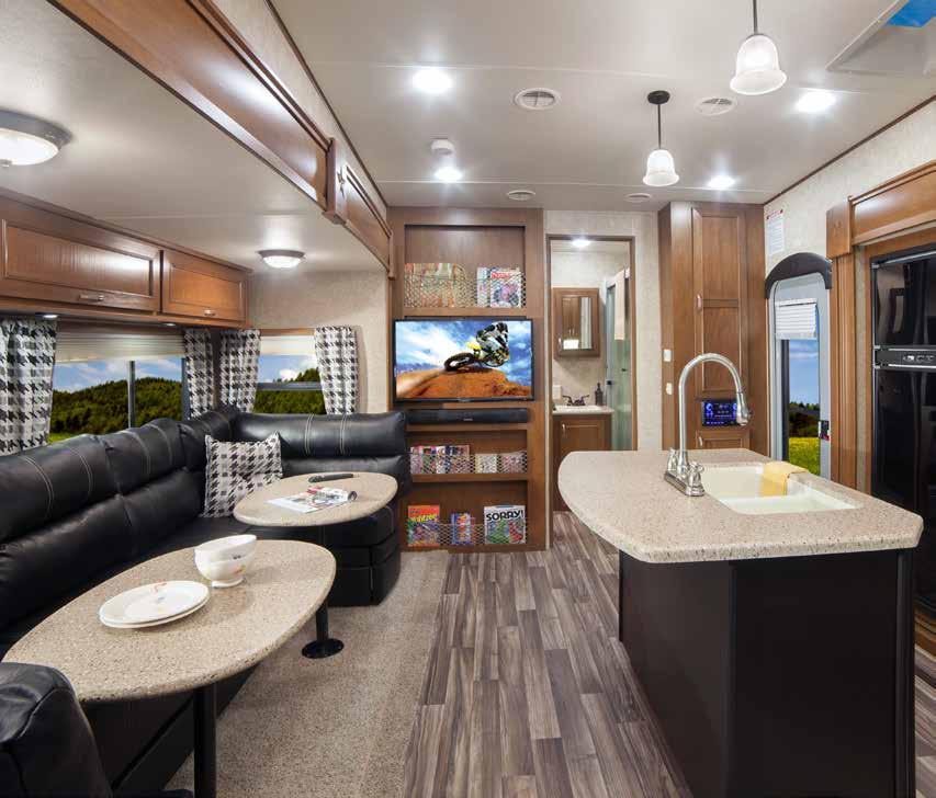 INTERIOR KITCHEN & LIVING ROOM HT31RGR Living Room 2 The Highlander, by Highland Ridge RV, is designed for the toy enthusiasts.
