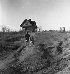 Marion Post Wolcott Children and old home on badly eroded land near Wadesboro, North Carolina. December 1938 Cotton pickers, Pulaski County, Arkansas.