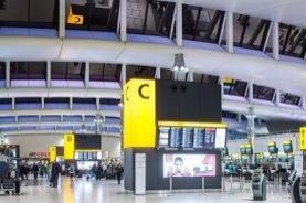 There are signs when you arrive telling you what zone to check in at Visual symbols, like this picture of a security check, can be seen on the yellow