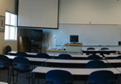 Room 218 is a larger classroom with rectangle tables, set in rows.