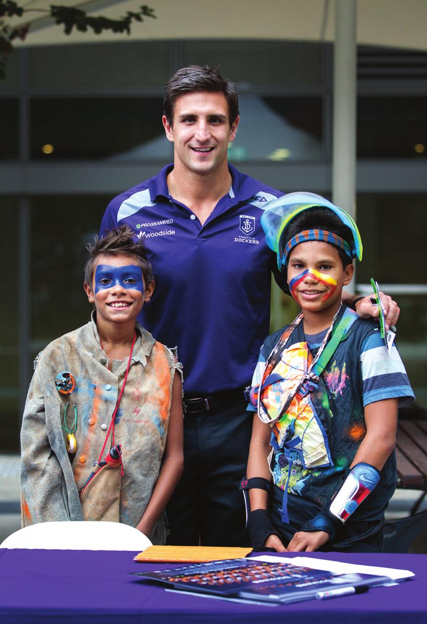 Fremantle captain Matthew Pavlich at the Woodside Season Launch event in March 2013, with Maverick and William Eaton, members of the