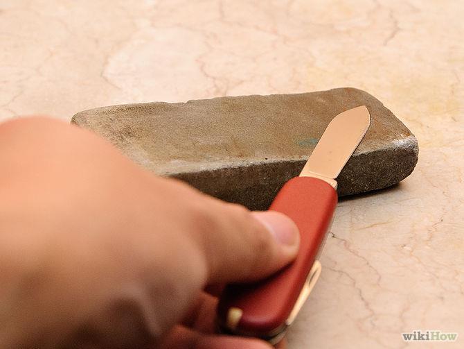 Blades that are curved or longer than your whetstone will need to be swept down and across the stone to evenly sharpen the entire blade. 6. Sharpen the other side of the blade.