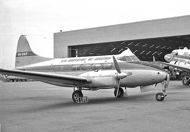 VH-DHF at Adelaide in 1962, dayglo orange tail.