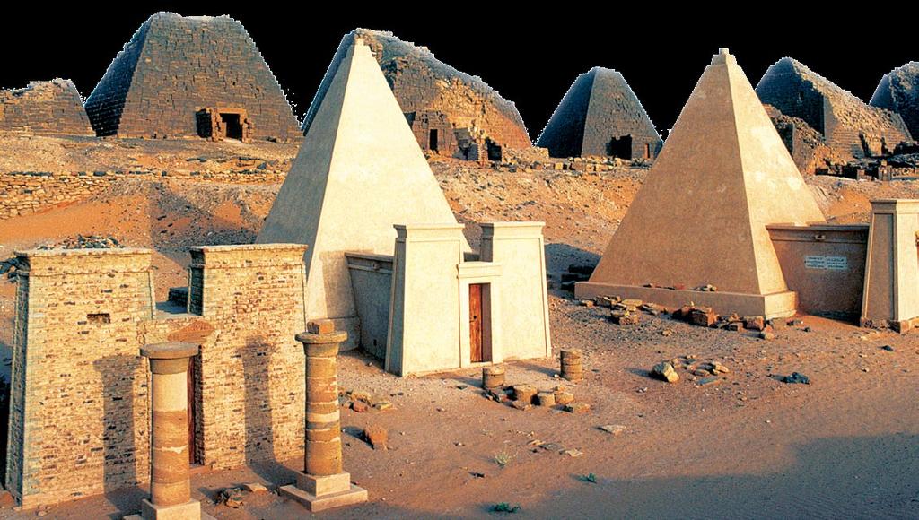 The ruins of ancient Kushite pyramids stand behind those reconstructed to look the way they did when originally built.