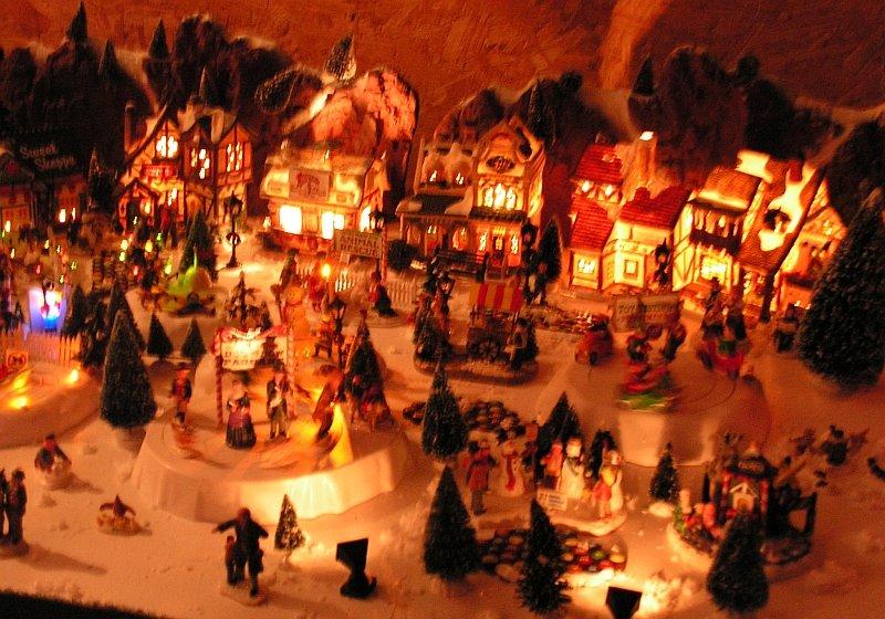 Areas between the tracks are filled with model houses and businesses all decked out for the holidays. Many figures form small scenes everywhere you look.