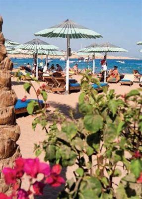 Location On the long sandy beach of Naama Bay, it is just 12 km from the airport, 5 minute s walk along the promenade to the centre of Naama Bay and 10 minutes by taxi from the old town.