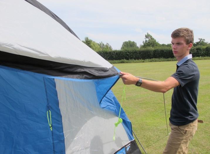 If the inner tent is not already installed, take the inner tent inside and suspend from the colour coded buckles (8).