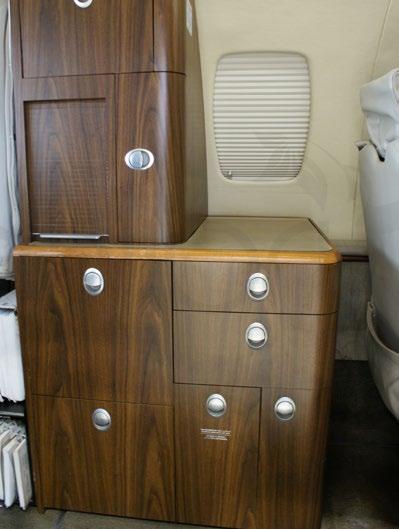The belted lavatory is separated from the cabin by an optional aft hard divider with sliding doors.