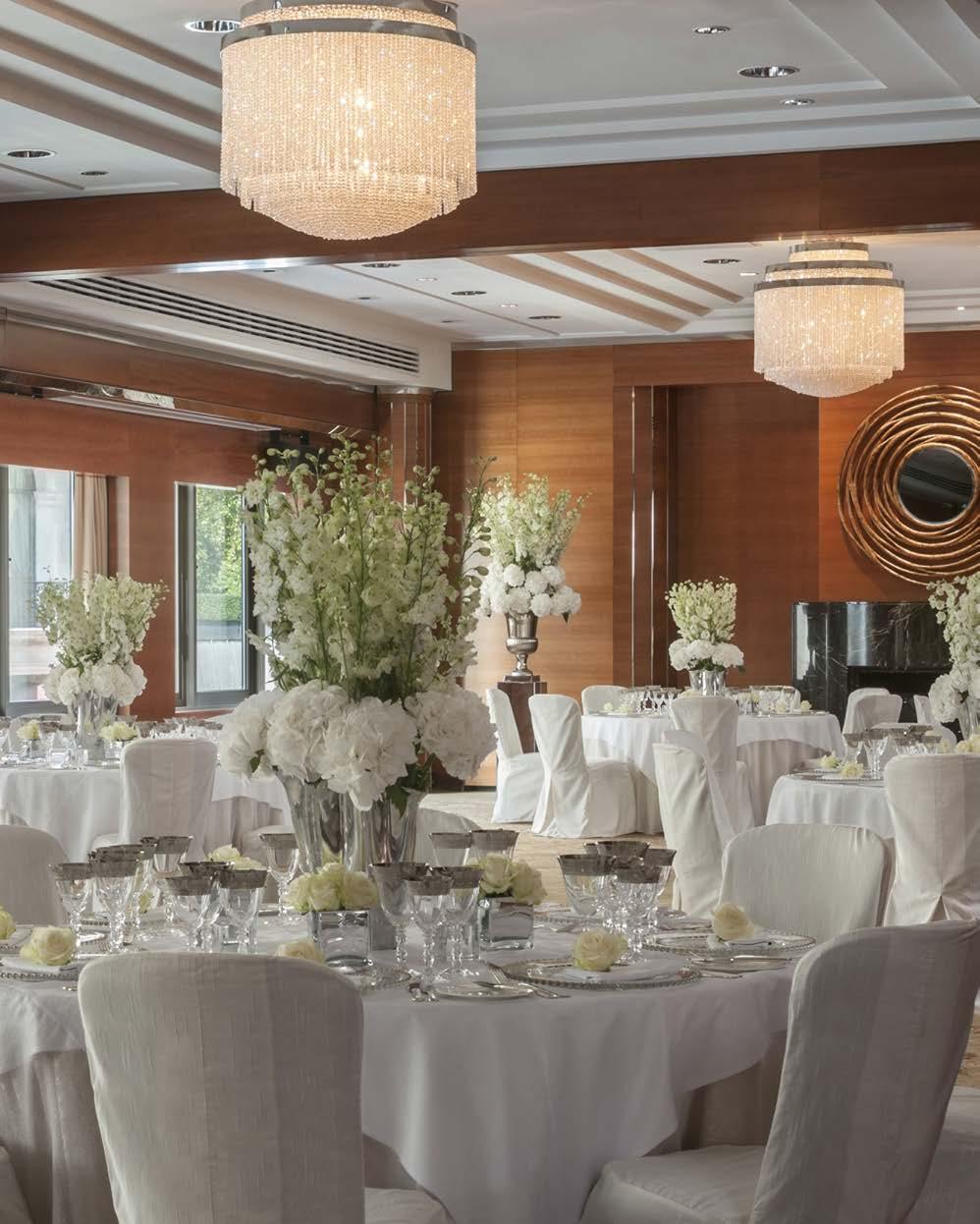 THE BALLROOM The sleek, state of the art Ballroom is elegantly decorated in cherry wood paneling with a centered marble fireplace and a full wall of