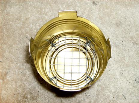 For a fire grate, cut out a piece of hardware cloth so it will slide into the can, resting on the 4 screws.