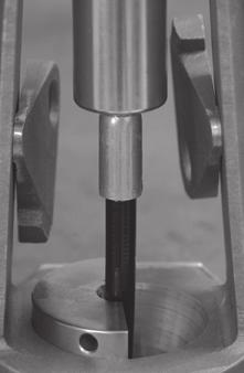 Push down on the die clamps firmly and evenly until there is no movement.
