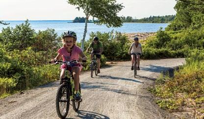 A CYCLING Forty-five km of bike paths go all around the peninsula along Lac Saint-Jean and Rivière Péribonka. Easy and accessible to everyone, they cut through beaver and moose habitat.
