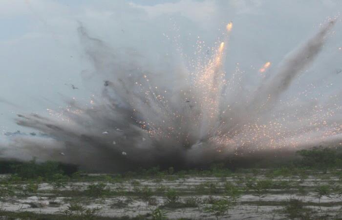 DAY 5 / THU 09 MAR / DONG HA - QUANG TRI - DMZ Controlled field demolition of ordnance destroyed by Project RENEW EOD team.