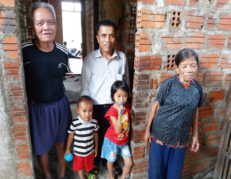Two families in A Luoi who are receiving support from VFP for livelihoods and home improvements through the Hearts for Hue organization.