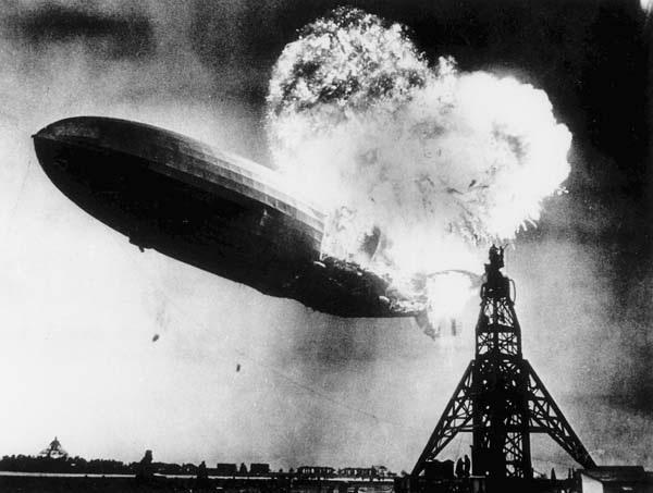 Figure 55: This photo, taken at almost the split second that the Hindenburg exploded, shows the 804-foot German zeppelin just before the second and third explosions send the ship crashing to the