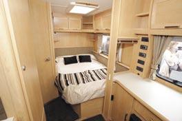 In the middle of the caravan there s a sideboard area, also housing the ruma blown air heater, and it has a window (with a Venetian blind) into the bedroom it s a fabulous V station, equipped with