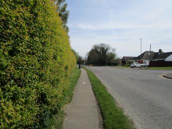 Wide verge, but services on left and layby on right. The best option may be to remove the existing path and construct a new path further from the carriageway 49.