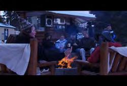 Alberta: Banff: People enjoying coffee and hot chocolate by fire (Winter) Clip #: 305