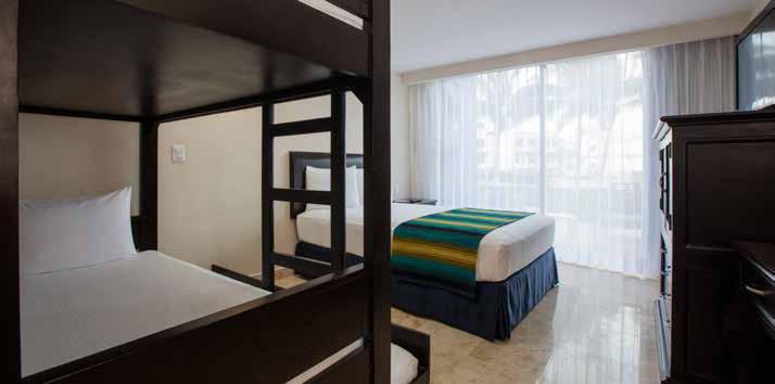 ROOMS FAMILY SECTION Paradise Family Suite: Located on the ground floor of the Paradise Tower; a two level room with ocean view, the first floor has a double bed, bunk bed with 3 beds,