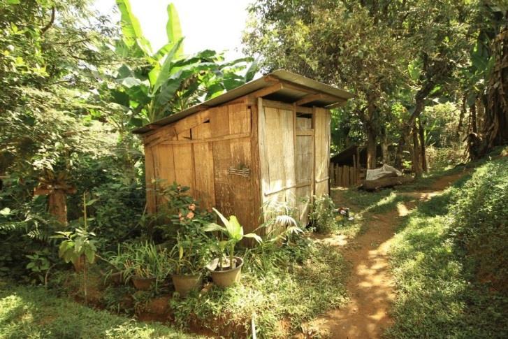What are the bathroom facilities like? The bathroom facilities are very basic and located in a small outhouse building near the homestay.