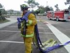 The firefighter should shorten the loops so that what goes on the shoulder is 6-8 ft. long.
