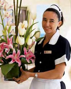 You are privately greeted and checked into your ocean-view suite, which is adorned with welcoming flowers.