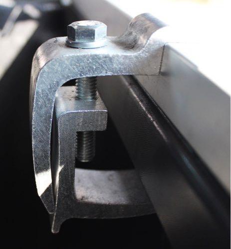 In order to ensure a secure fit, avoid clamping onto such ridges. 3. Using a 9/16 wrench or socket, snugly fasten the clamp bolts until the bedrail is not able to shift. Do not over tighten.