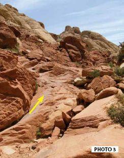 Follow the sandy trail as it heads SE; see Photo 2. The trail disappears as it ascends a sandstone ramp; see Photo 3. Just beyond this ramp, you ascend sandstone steps off to the right.